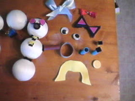 Make a Potato head style toy from recycled Christmas Decorations and Ornaments.