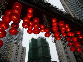 red Chinese lanterns and a building under construction farther away