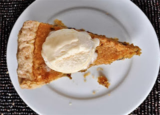 Pumpkin Sponge Tart: A pumpkin-based sponge mixture baked in a shortcrust shell, served as a wedge with a cream topping