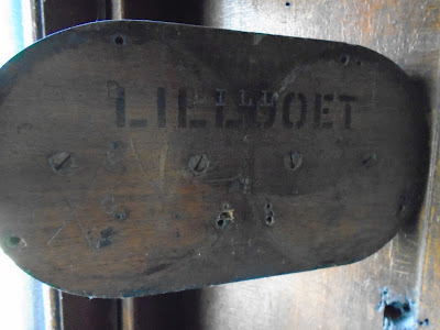 A wooden sign with the word "Lillooet"