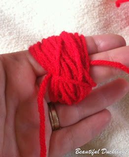 How to Make a Messy Pom Pom Using Your Hands photo tutorial