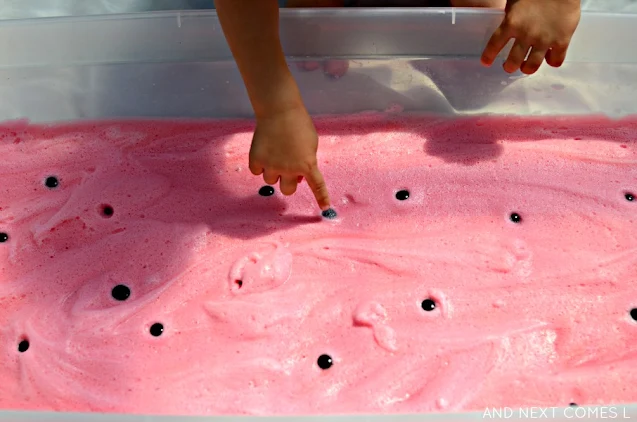 Watermelon inspired soap foam sensory play with black seeds