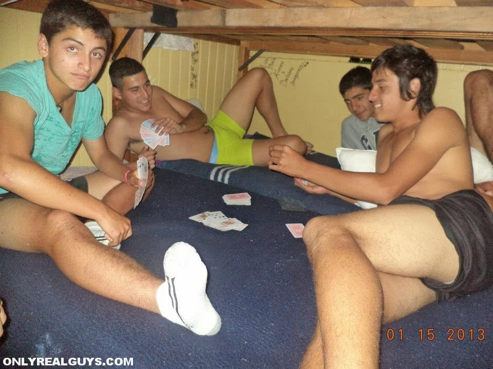 Half naked Latino college boys playing strip poker. 