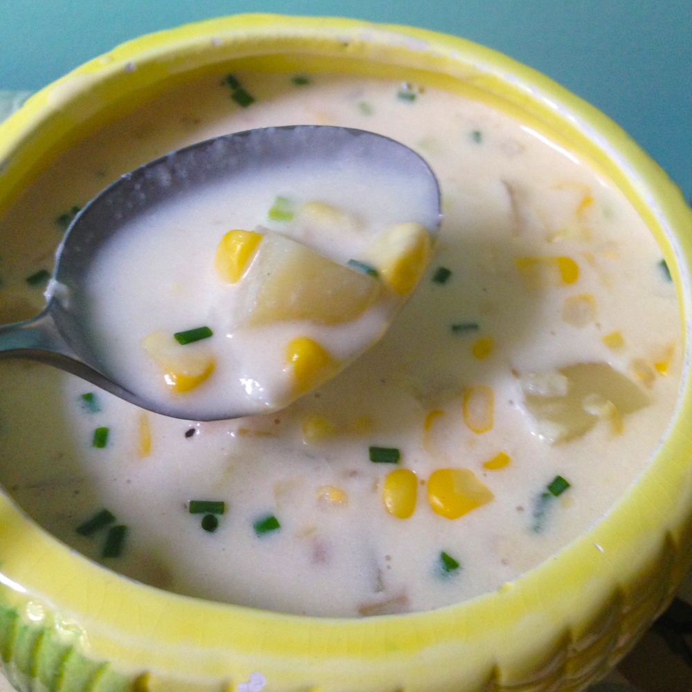 spoonful of creamy vegetarian corn chowder