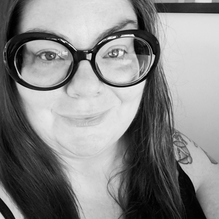 image of me in close-up, wearing large black-framed glasses, in a black and white photo