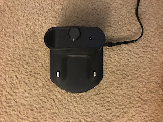 An empty home base charging station for iRobot Roomba 690