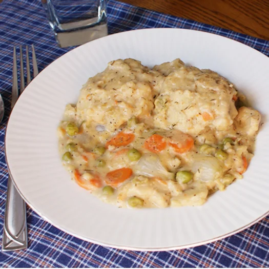 Chicken and Buttermilk Dumplings made from scratch is a hearty, comforting, stick-to-your-ribs, soul-satisfying meal made with a rich and creamy stew topped with tender herb-seasoned dumplings.