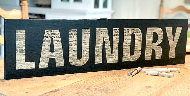 Laundry sign with newspaper words