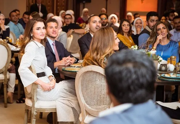 Queen Rania of Jordan held an Iftar banquet for Jordanian youth at Basman Palace wore asymmetric belted shirt dress, she carried Louis Vuitton bag