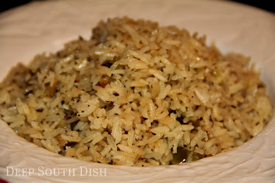 Rice and a Trinity of veggies are first sauteed in butter, then simmered in chicken stock for a wonderful rice side dish that is just as good for pork, as it is for chicken, shrimp, fish, or beef.