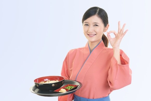 korean woman holding a food