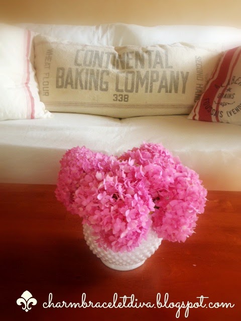 milk glass vase pink hydrangeas coffee table