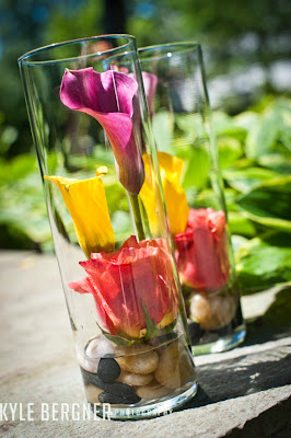 Colorful cylindrical vase floral arrangement by DellaBlooms