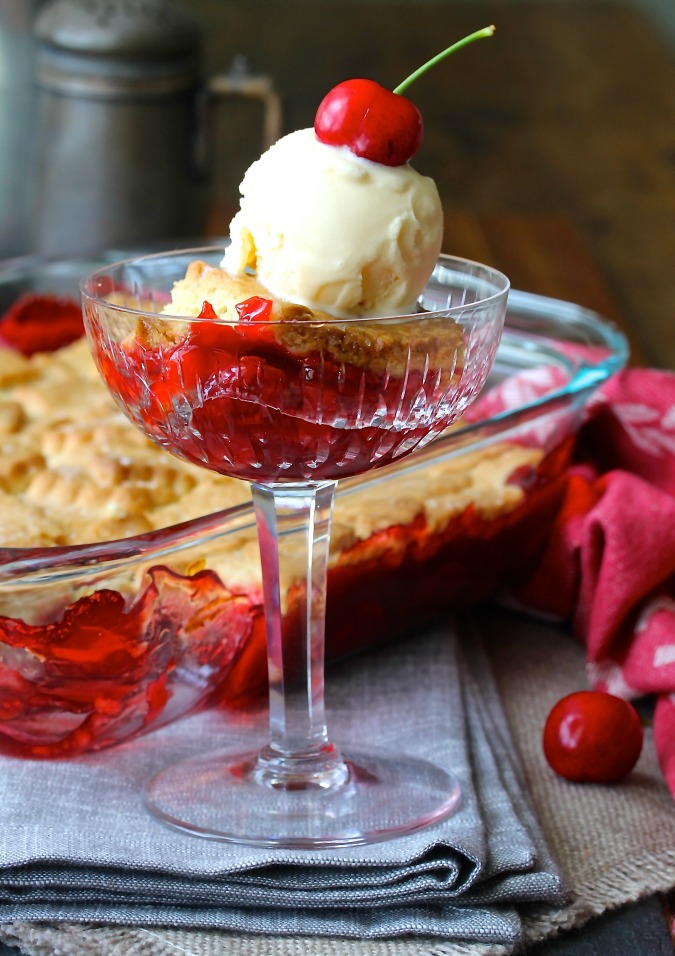 This Cherry Cobbler with a Sugar Cookie Crust is so delicious served warm and topped with vanilla ice cream. 