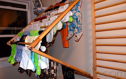 Drying rack in laundry room made from old playpen folds flat :: OrganizingMadeFun.com