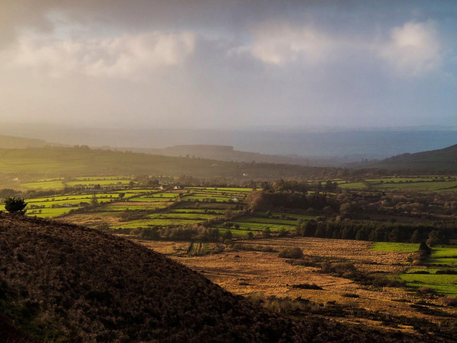 Sunset mist Hazy sunset landscape of a valley in North Cork.