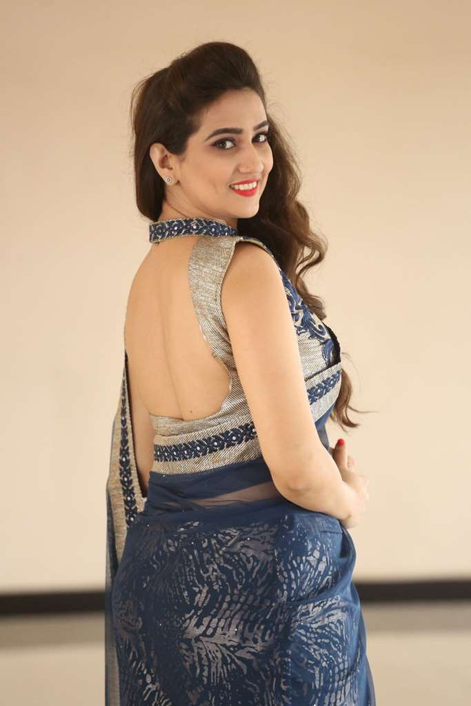 Glamorous Anchor Manjusha Back Show Images In Blue Saree