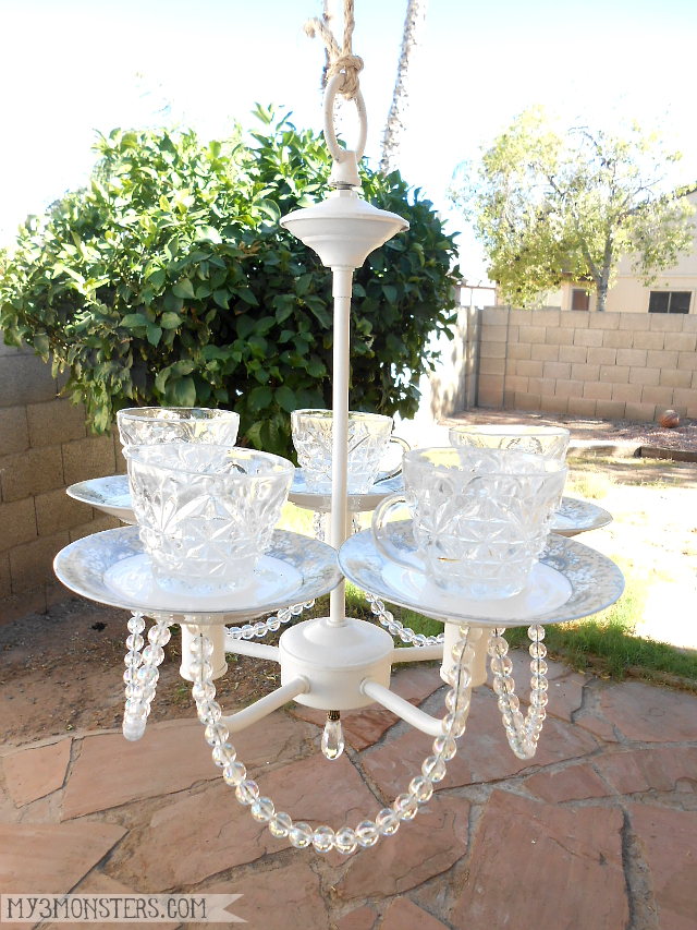 Make a birdfeeder out of an old chandelier and thrifted tea cups!  Tutorial at /