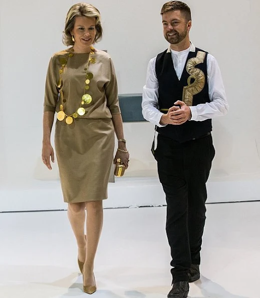 Queen Mathilde visited the 2016 Biennale Interieur Exhibition  at the Kortrijk Xpo in Kortrijk. Queen Mathilde wore Mattijs van Bergen dress, Natan necklace, DFV gold clutch bag