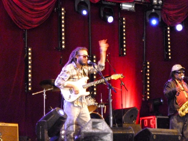 band on stage at a festival camp bestival