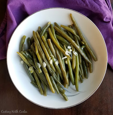 These garlic soy green beans are easy, delicious and cook quickly with the help of a pressure cooker. bowl of green beans ready to serve