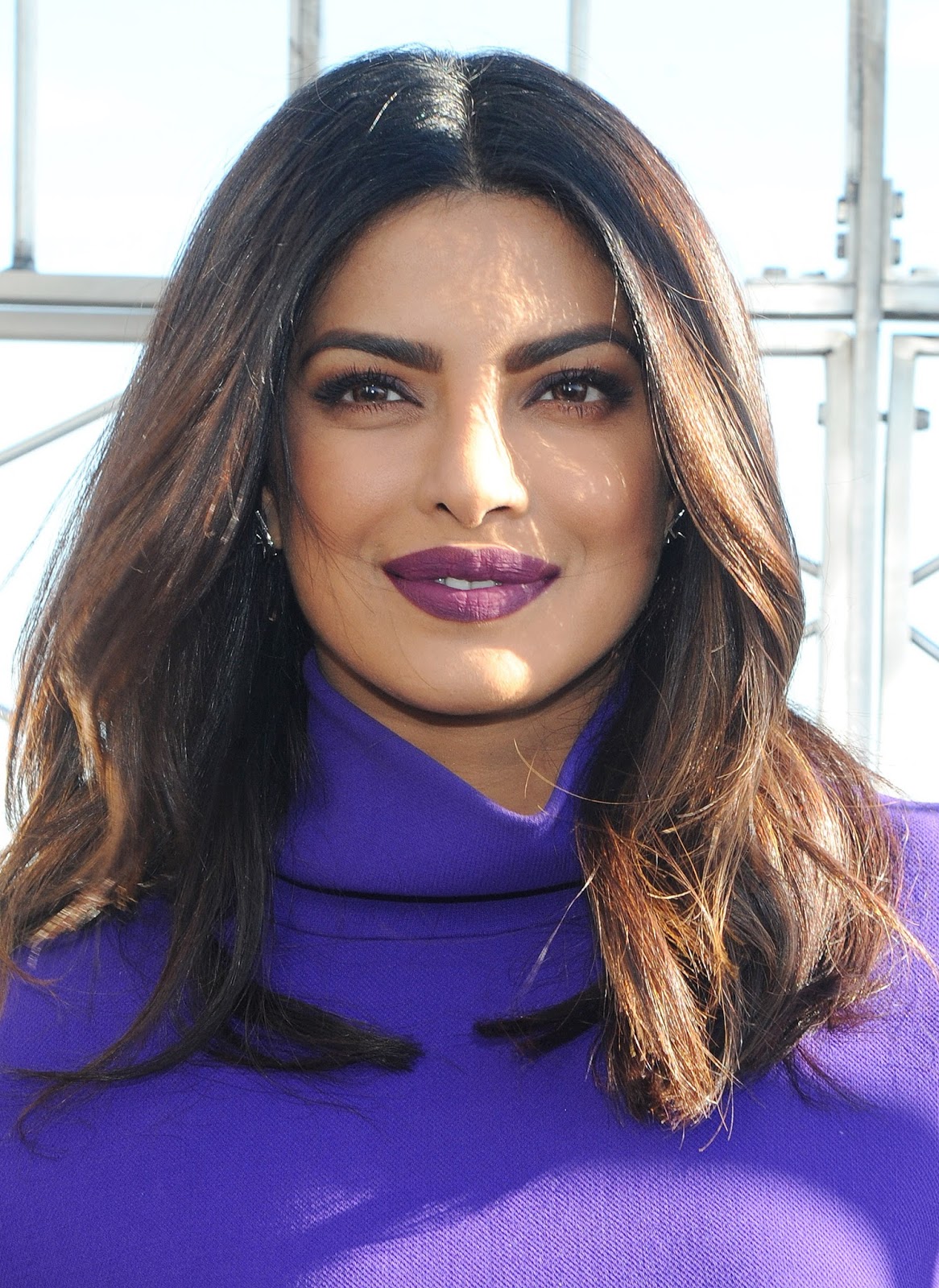 Priyanka Chopra Looks Sexy In a Purple Short Dress and Black Thigh High Boots During â€œQuanticoâ€ Promotion at The Empire State Building in New York City