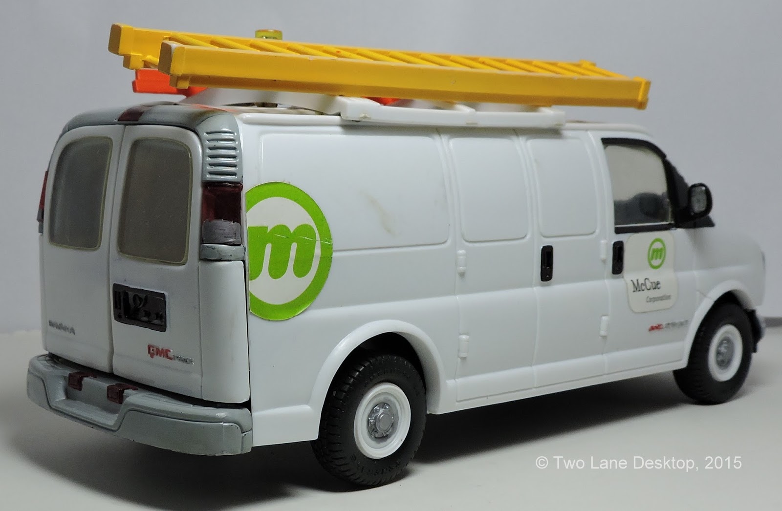 124 GMC Savana work van, Brookfield Chevy Express van, and Johnny Lightning and Maisto Chevy