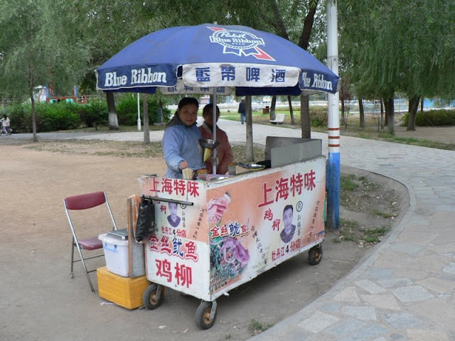 food cart with Pabst Blue Ribbon Beer umbrella