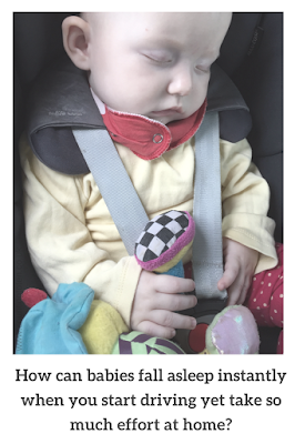 Photograph of a baby sleeping in a car seat