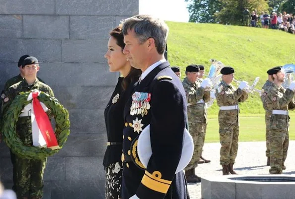 Crown Prince Frederik of Denmark and Crown Princess Mary of Denmark attended the traditional wreath-laying ceremony