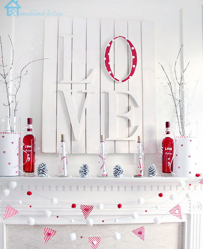 white and red mantel with LOVE wall plaque