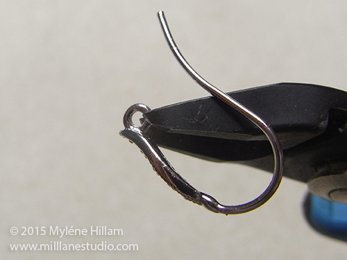 Cutting the closed loop on an earring wire with wire cutters