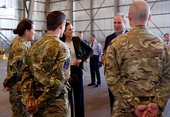 Kate Middleton's wearing her Smythe Duchess Blazer in Army green, and she carried L.K. Bennett Dora Khaki suede clutch