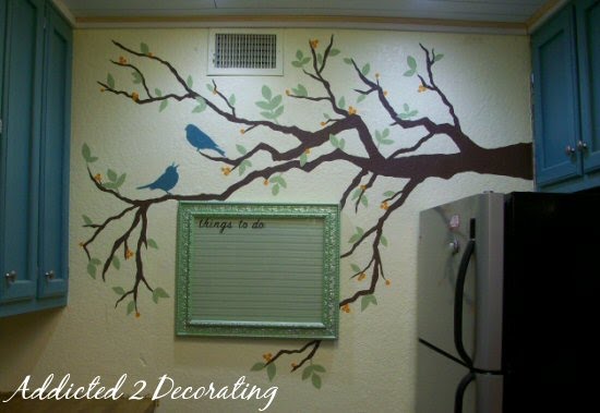 hand painted tree mural on the wall