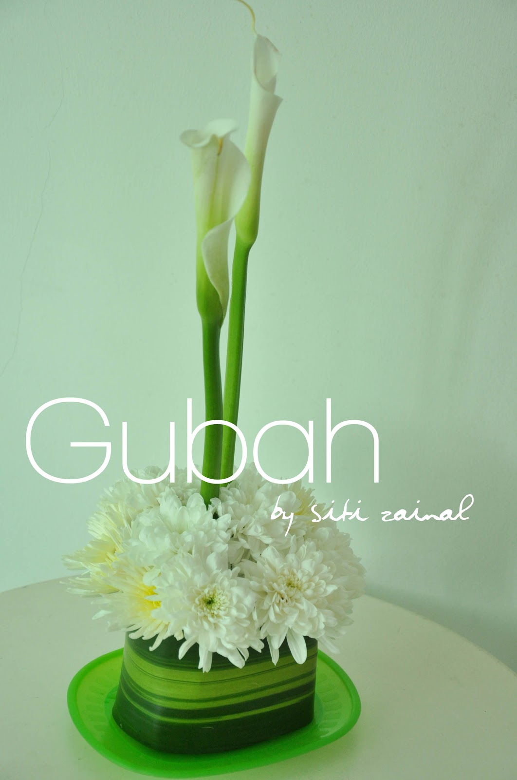 Gubah by Siti Zainal centerpiece samples calla lilies and gerbera