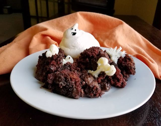 So sweet and so spooooooky! This trifle is full of chocolate goodness with sweet meringue ghosts and white chocolate bones. It's a great Halloween treat! chocolate cake and pudding trifle with white chocolate bones and meringue ghost