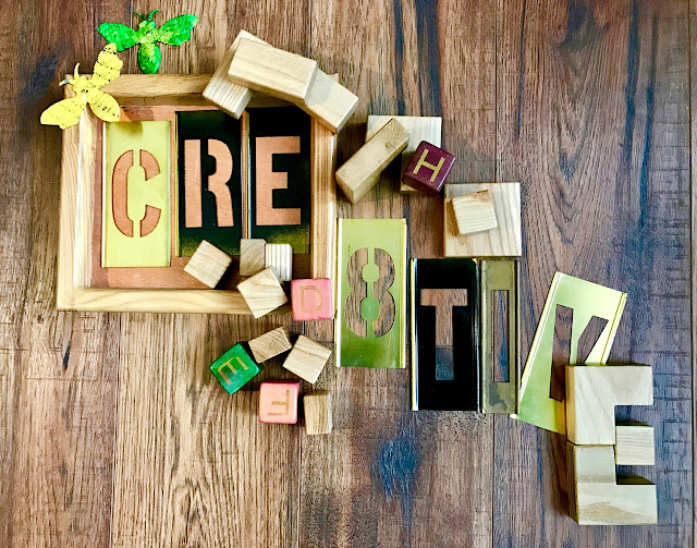 "Cre8tive" spelled out in blocks and stencils "Cre8tive" spelled out in blocks and stencils