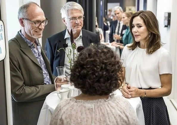 Crown Princess Mary of Denmark attended the opening of a new Grief Center. Princess wore Hugo Boss blouse, blue skirt