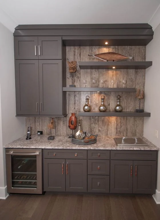 kitchenette with gray cabinets and shelves