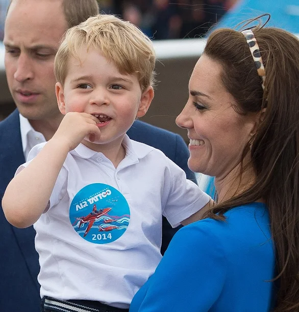 Prince William, Kate Middleton and Prince George visit the Royal International Air Tattoo at RAF Fairford. Kate wore Stella McCartney dress