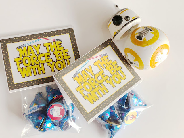 Celebrate Star Wars Day with this fun and simple treat for your kids' lunchboxes or family dinner party.  These Star Wars bag topper printables are a fun addition to any party favor by adding the Star Wars kisses or any Star Wars treat. Such an easy and fun way to make anyone's day a little more awesome.