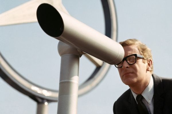 Michael Caine as Harry Palmer looking through a telescope