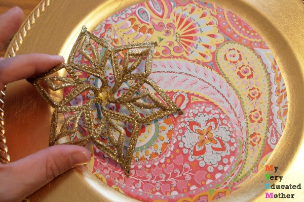 Now's the time to stock up on simple glittered ornaments from the dollar store. You can use them in all types of crafting long after the holidays. Adding embellishments to Dollar Store Christmas Card Holder