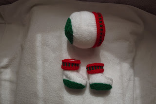 http://www.craftsy.com/pattern/knitting/accessory/white-christmas-beanie-hat-and-booties/164952?