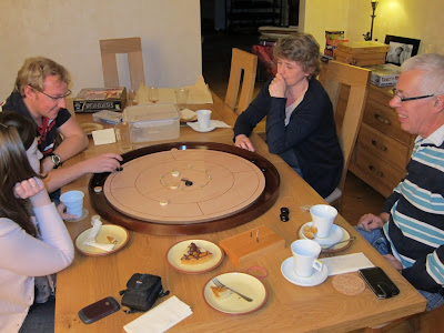 Crokinole - The game being played by some of our Monday night group