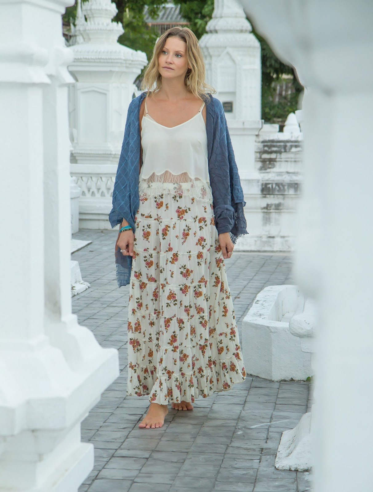 Fashion and travel blogger, Alison Hutchinson, is wearing a long skirt and scarf to cover up at the temples in Chiang Mai, Thailand