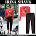 Irina Shayk in red Mickey Mouse sweater and black pants in NYC on May 29
