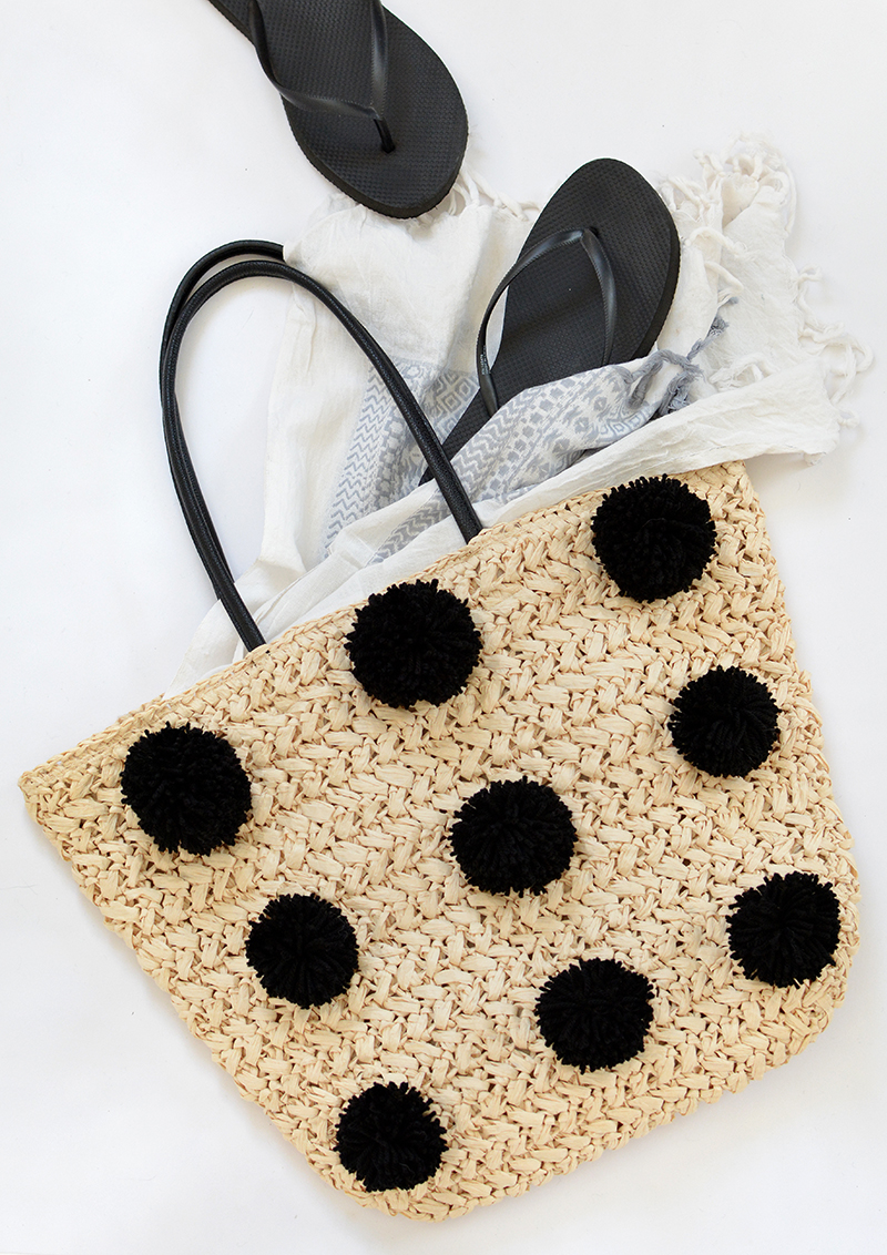 Makeover Your Plain Wicker Beach Tote With a Skien of Pompom Yarn