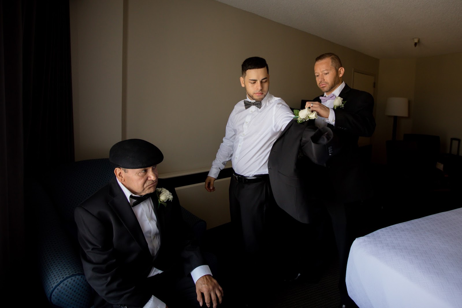 Best Man Helps Groom Finish Up, Father Waiting Patiently