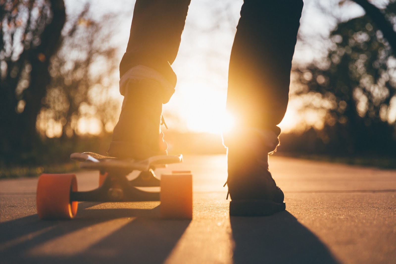 Close-up of Leg and Sneakers on Skateboard Photography